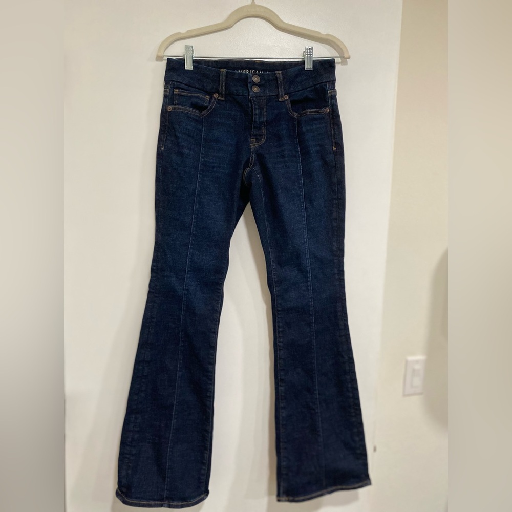 American Eagle Next Level Low-rise Kick Bootcut Jeans, dark wash front leg seams